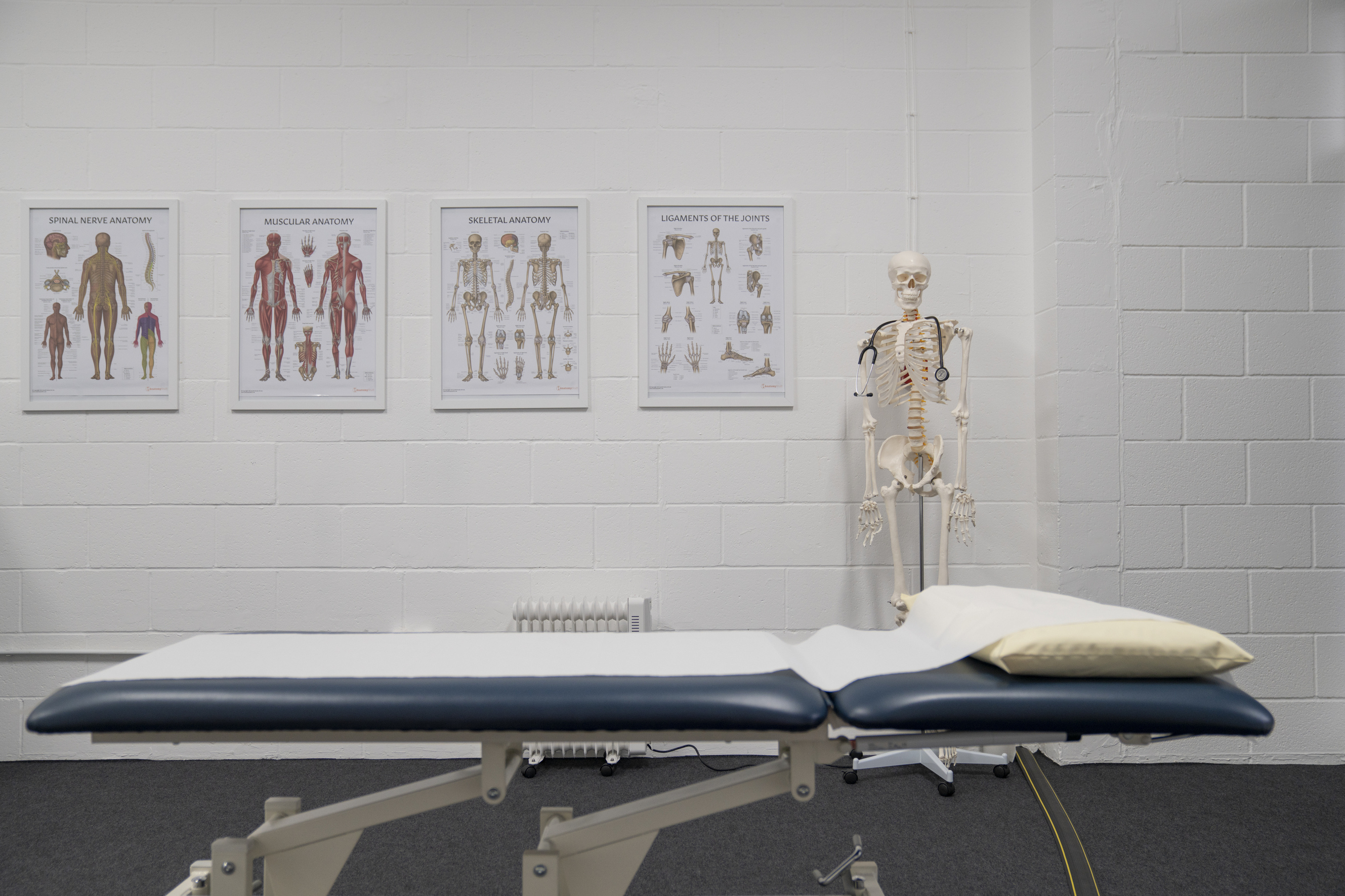 Photograph of physiotherapy bench with posters