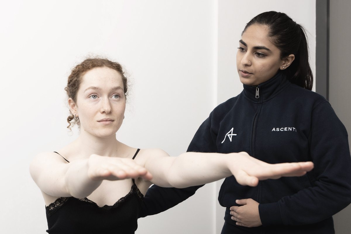 Photo of Ascenti Physiotherapist guiding patient to complete exercise