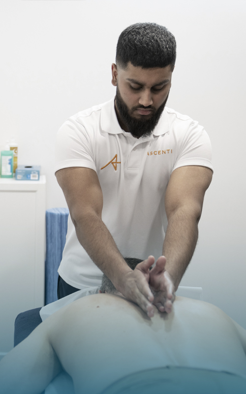 Photograph of male Ascenti physiotherapist providing manual therapy treatment