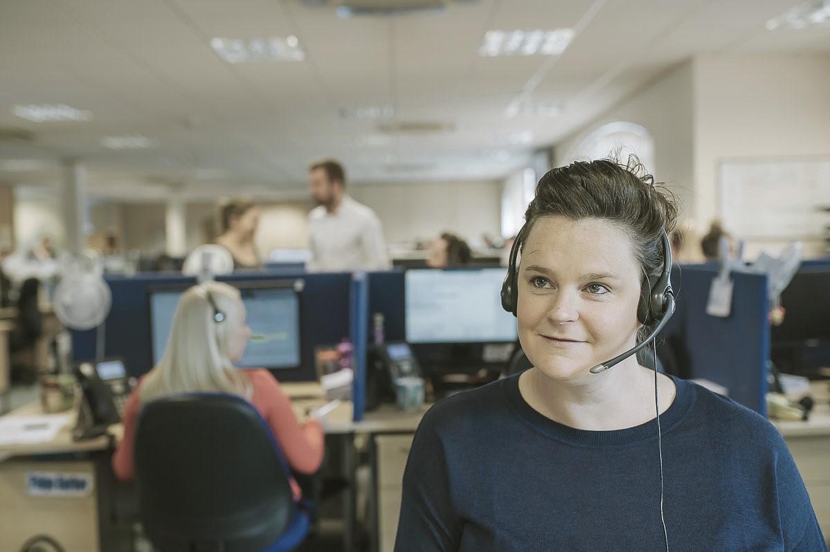 Female office worker on phone