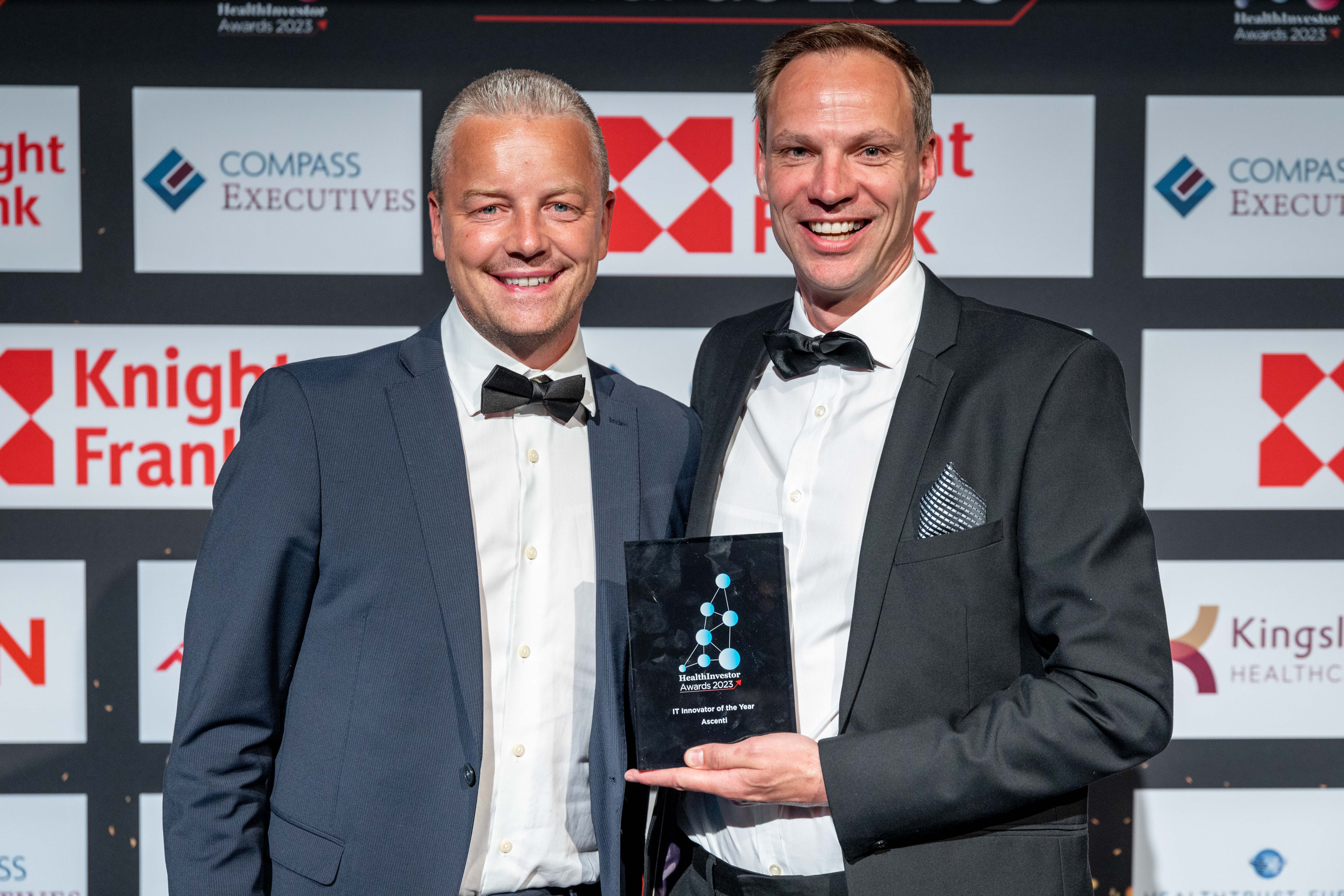 Ascenti’s Chief Commercial Officer, Kevin Doyle, and Director of Strategic Development, Martin Fidock, collecting the IT Innovator of the Year award