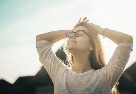 Lady in the outdoors looking stress free